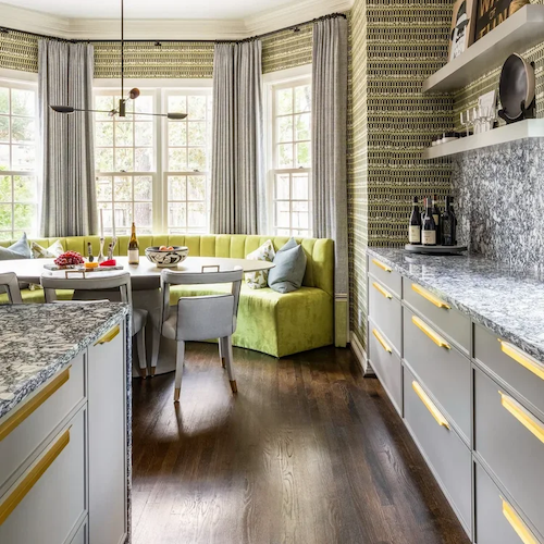 Luxury residential interior design kitchen with curved banquette seating, patterned wallpaper, and stone surfaces in Houston
