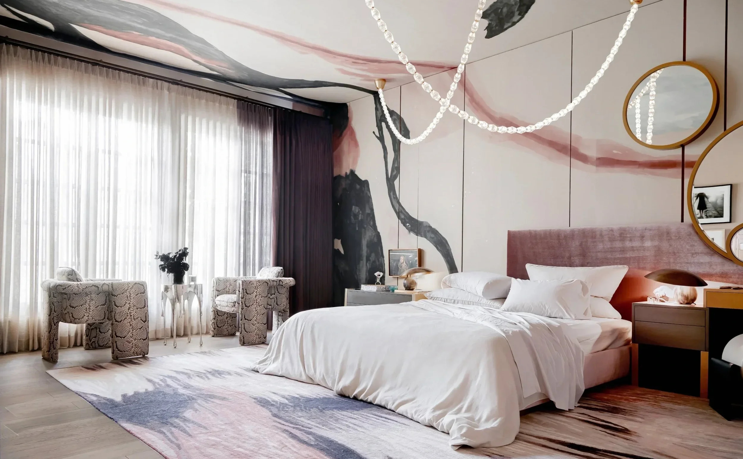 Luxury residential bedroom interior design with artistic wall treatment, layered textiles, and a tailored boutique-hotel feel