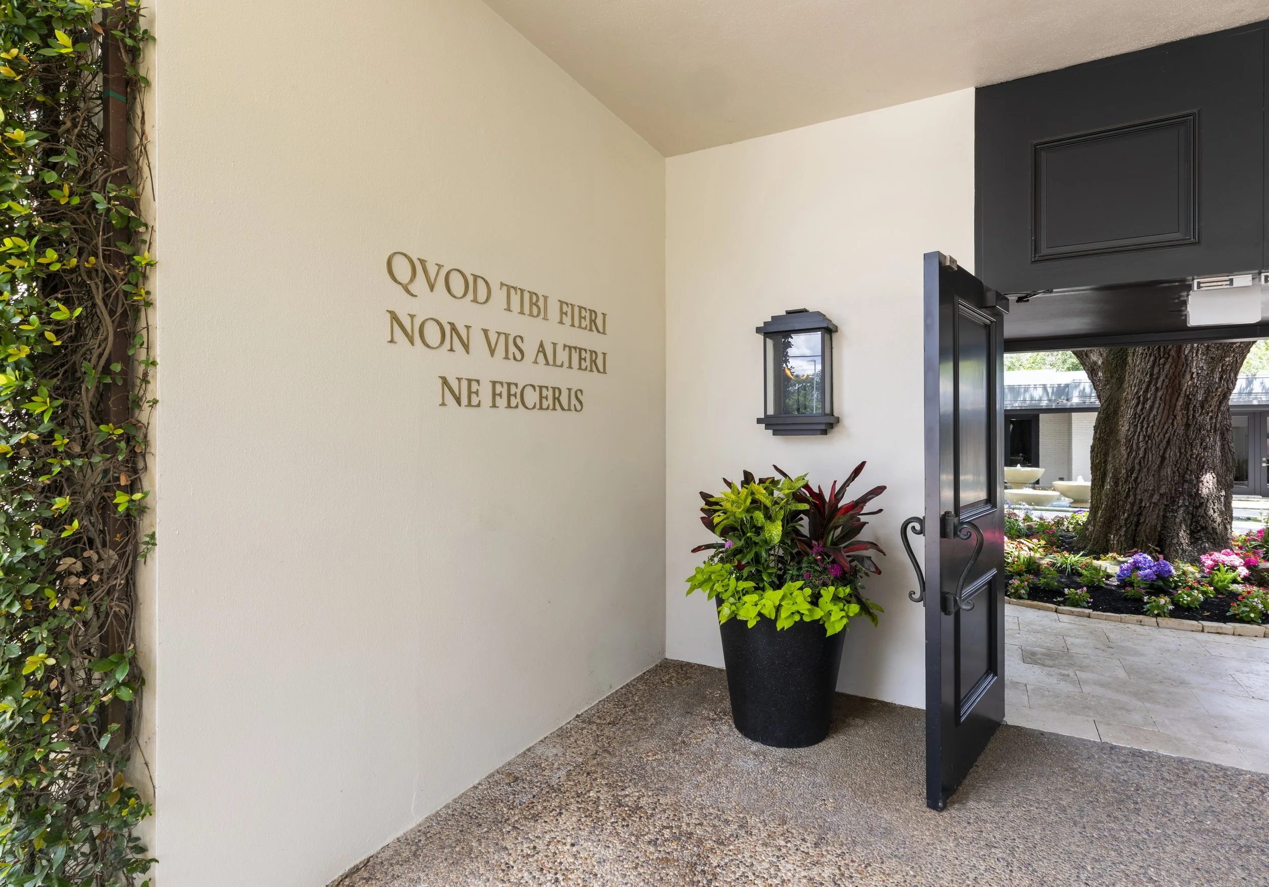 Concierge medical clinic entrance in River Oaks Houston, illustrating high-end commercial interior design with a discreet luxury approach.