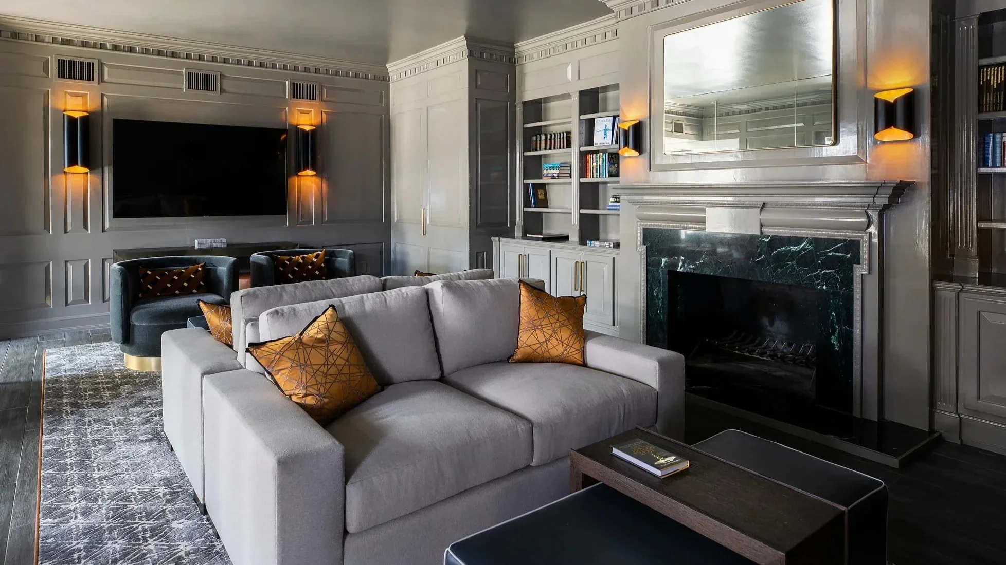 Modern luxury living room interior design in Houston at Sydenham showcasing fireplace feature wall and bespoke cabinetry.