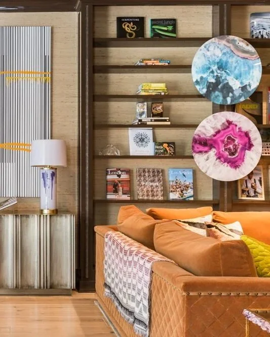 Luxury living room interior design in Houston with sculptural lighting, geometric rug, and tailored furnishings at Timberwilde.
