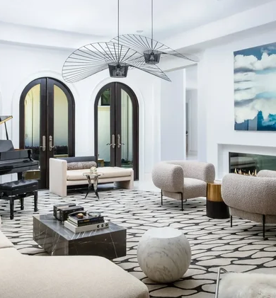 Luxury residential interior design living room with arched doors, piano, and graphic rug by Lucinda Loya Interiors